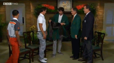 Bubba Watson presents Scott with the green jacket.