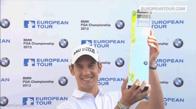 05.26.13-manassero-kisses-trophy