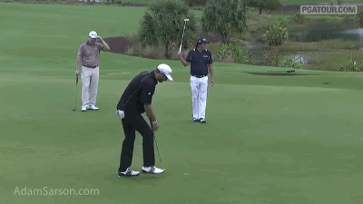 Jason Dufner sends one into the water.
