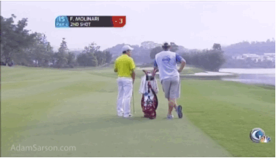 Francesco Molinari's caddie really gets into the grass toss.
