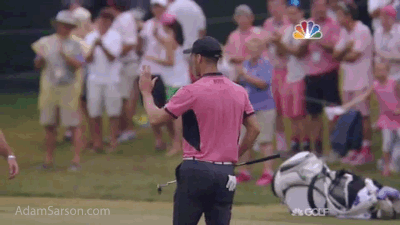 Failed high five with his caddie after.