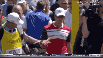 Stenson snaps a wedge and calmly hands it to his caddie.