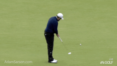 Shane Lowry tries to eat his putter.
