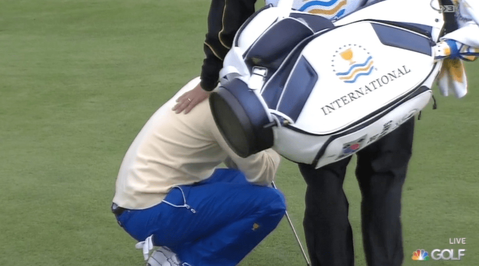 Sang-moon Bae is consoled by his caddie at the Presidents Cup.