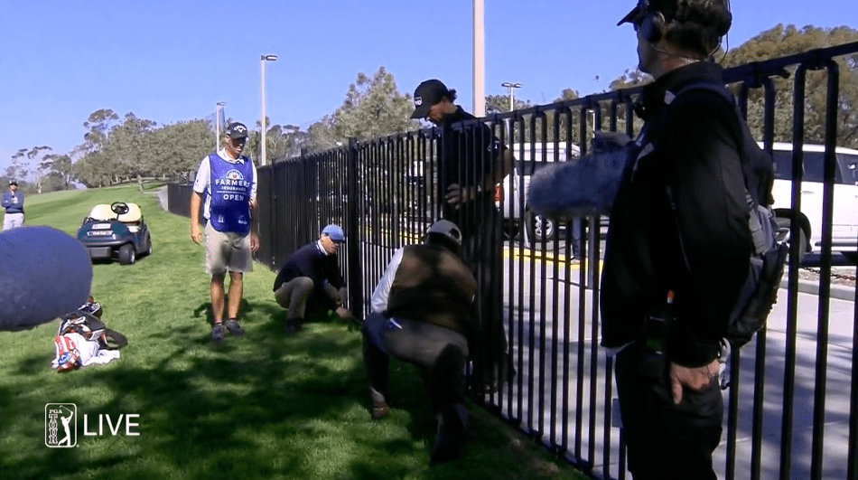 Phil peering over the fence. (Courtesy: PGATourLive.com)